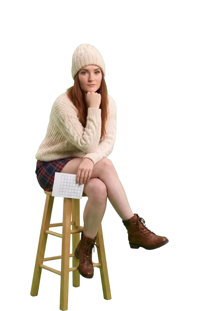 Woman on a stool thinking with her chin on her fist