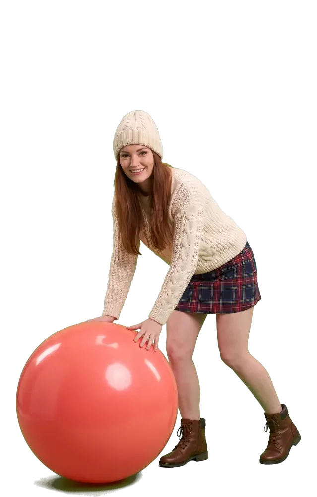Woman pushing a giant coral ball