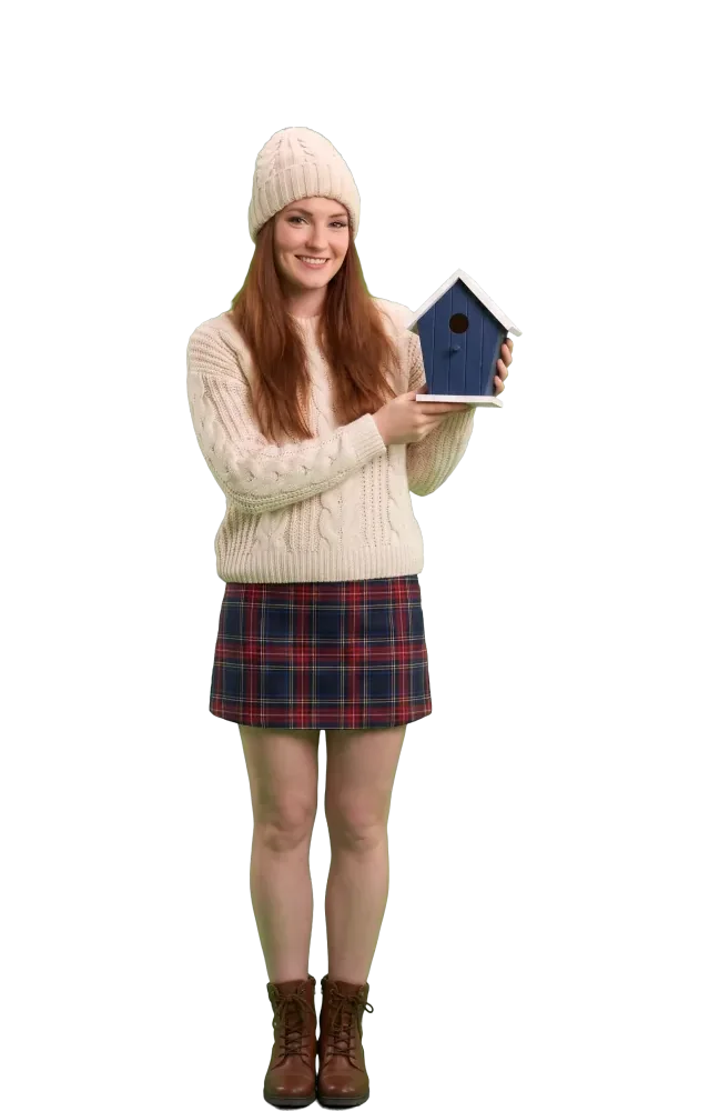Woman holding a small navy birdhouse